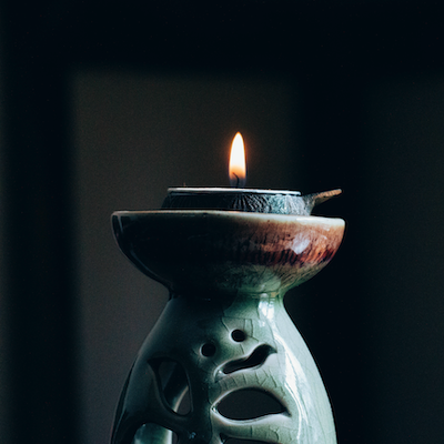 A lit candle A lit candle